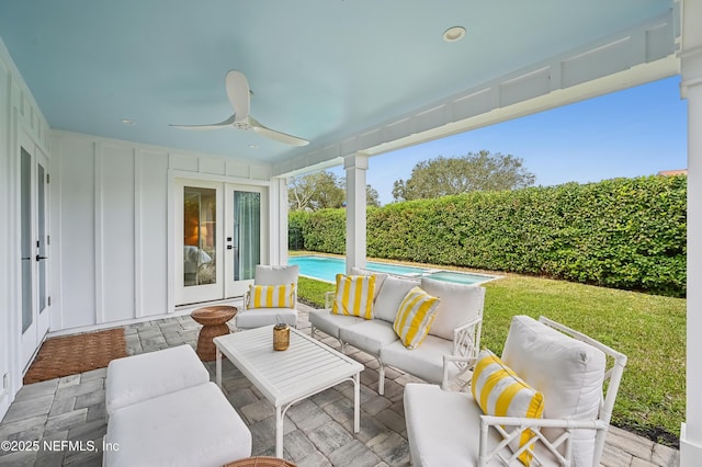 view of patio / terrace featuring an outdoor living space, a fenced in pool, french doors, and ceiling fan