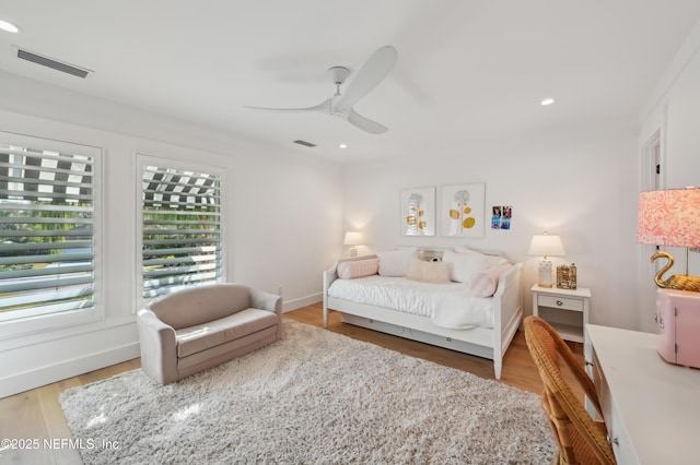 bedroom with ceiling fan and hardwood / wood-style floors