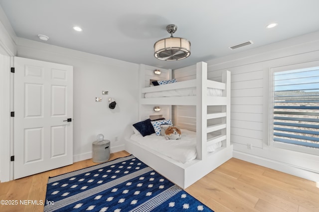 bedroom with wood-type flooring