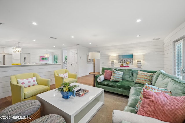 living room featuring wooden walls