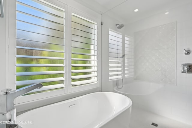 bathroom featuring separate shower and tub