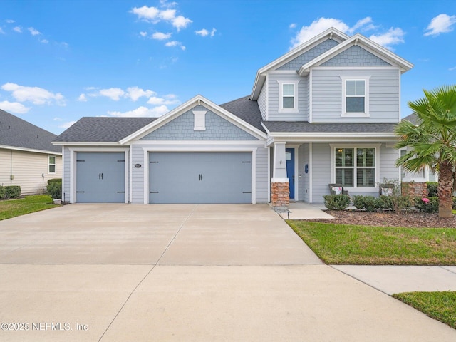 craftsman house featuring covered porch and a garage