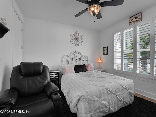 bedroom featuring ceiling fan and hardwood / wood-style floors