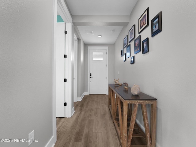 hallway featuring wood-type flooring