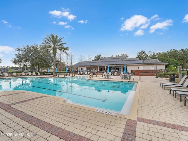 view of swimming pool with a patio area