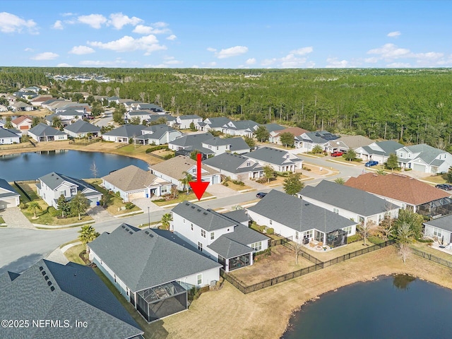 bird's eye view with a water view