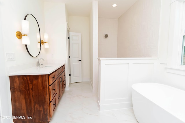 bathroom featuring a tub and vanity