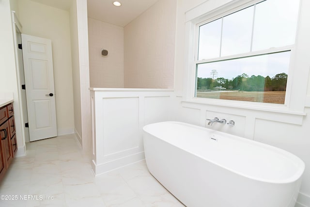 bathroom featuring separate shower and tub and vanity