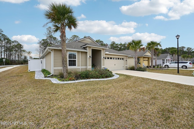 view of front of home featuring a front lawn and a garage