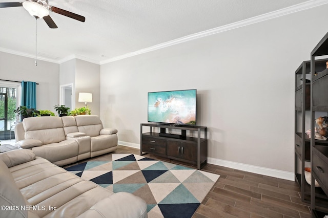 living room with ceiling fan and crown molding