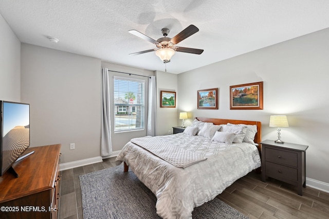 bedroom featuring a textured ceiling and ceiling fan