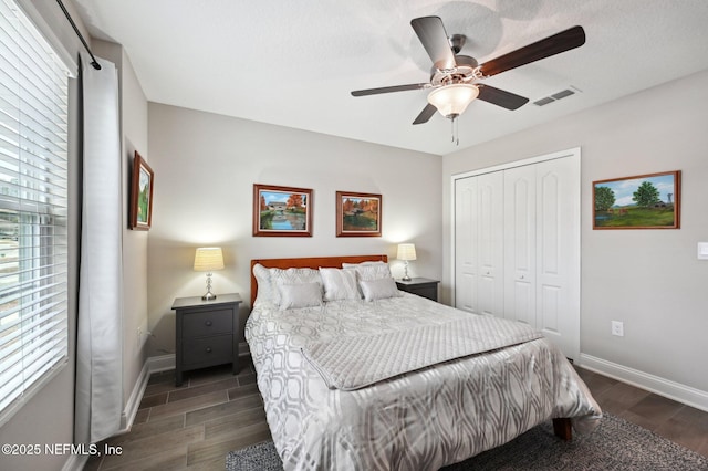 bedroom with ceiling fan and a closet