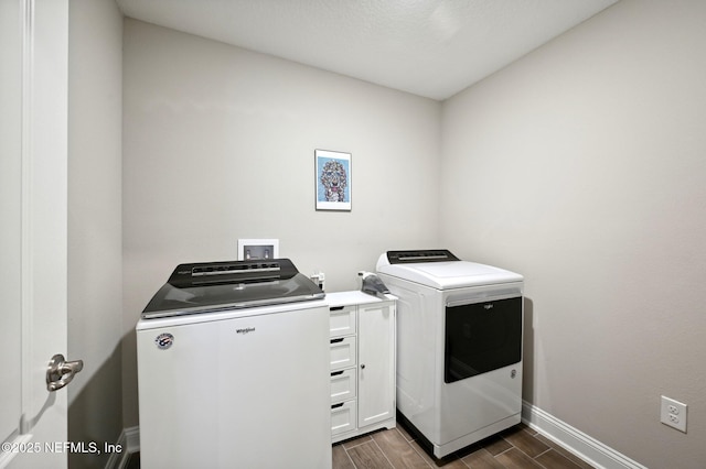 washroom featuring washing machine and dryer