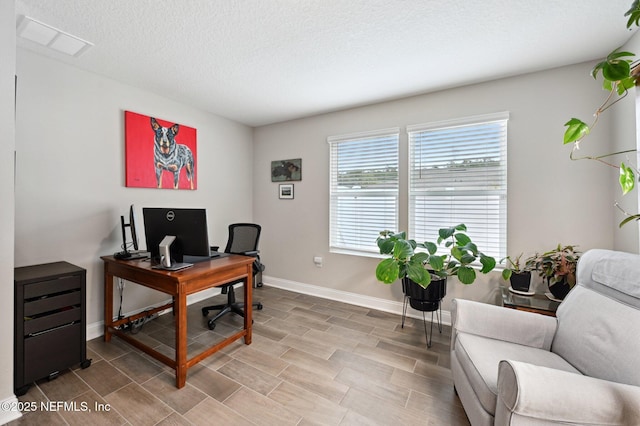 office space featuring a textured ceiling