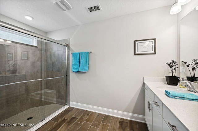 bathroom featuring vanity and walk in shower