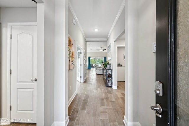 hall with crown molding and wood-type flooring