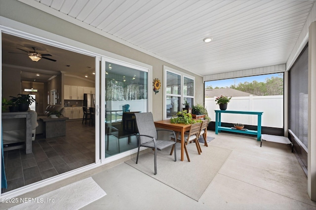 sunroom / solarium with ceiling fan