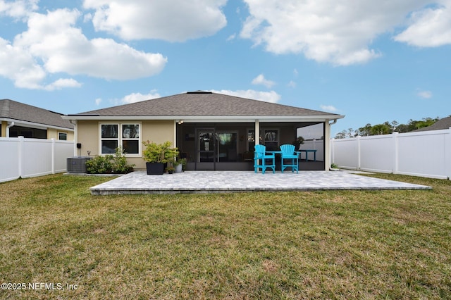 back of property with a lawn, central AC, a sunroom, and a patio