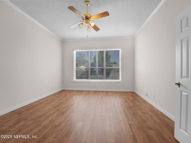 unfurnished room featuring crown molding, ceiling fan, wood-type flooring, and a textured ceiling