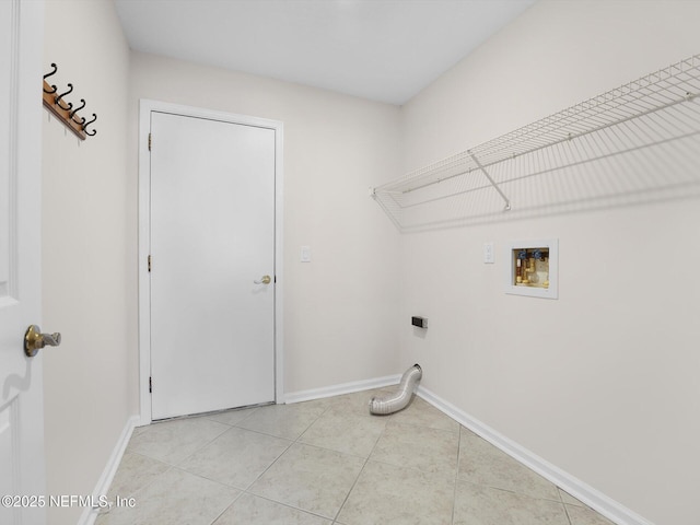 clothes washing area featuring hookup for a washing machine, electric dryer hookup, and light tile patterned floors