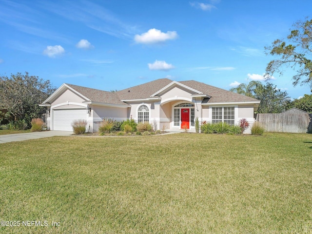 single story home featuring a garage and a front lawn