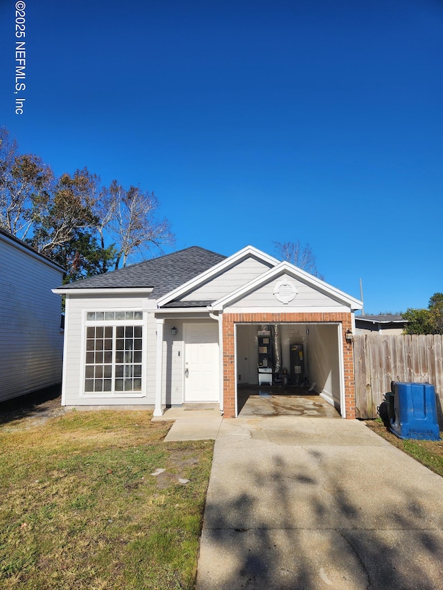 view of front of property with a garage and a front lawn