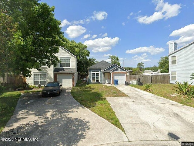 front of property featuring a garage and a front yard