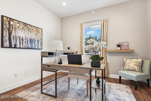 home office with wood finished floors and baseboards