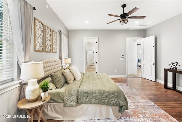 bedroom with recessed lighting, visible vents, baseboards, and wood finished floors