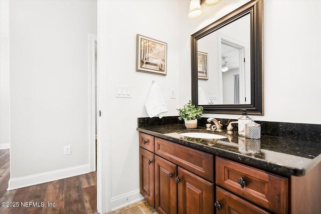 bathroom with vanity and hardwood / wood-style flooring