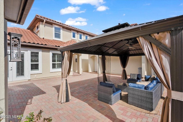 view of patio featuring a gazebo and an outdoor hangout area