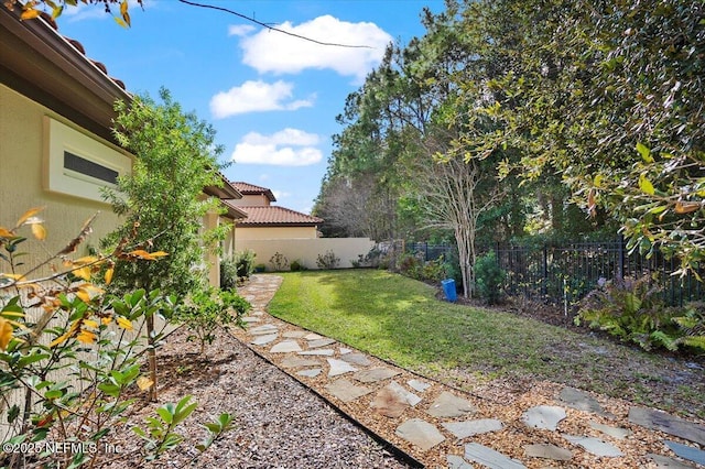 view of yard with a fenced backyard