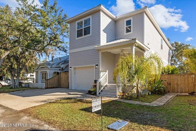 view of front facade featuring a front lawn and a garage