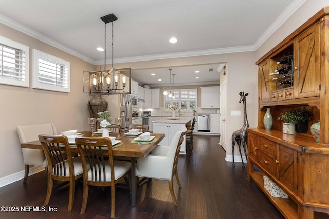 dining space with ornamental molding and dark hardwood / wood-style floors