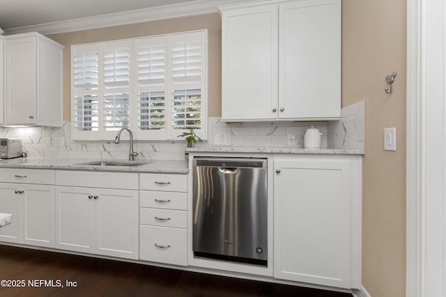 kitchen with sink, light stone counters, stainless steel dishwasher, decorative backsplash, and white cabinets