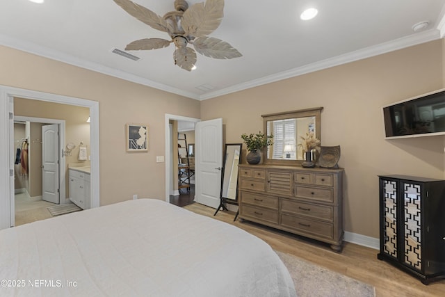 bedroom with ornamental molding, ensuite bathroom, ceiling fan, and light wood-type flooring