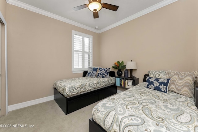 carpeted bedroom featuring crown molding and ceiling fan