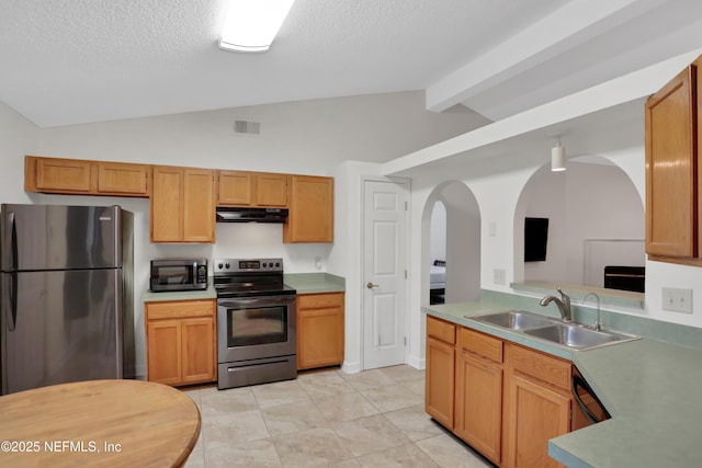 kitchen featuring a textured ceiling, appliances with stainless steel finishes, sink, light tile patterned flooring, and beam ceiling