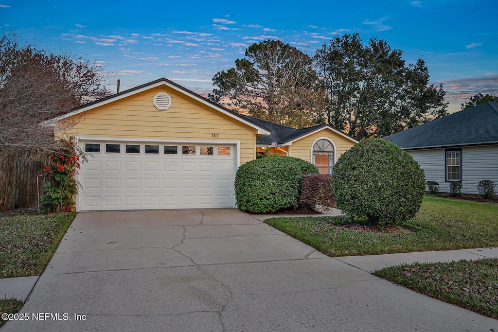 single story home featuring a garage