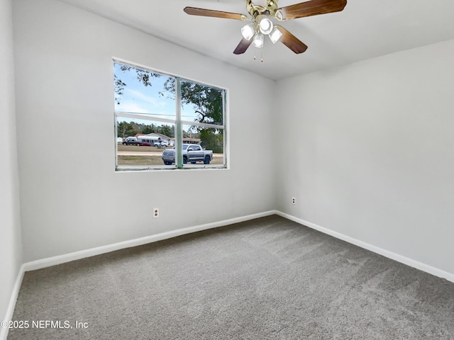 empty room featuring ceiling fan and carpet flooring