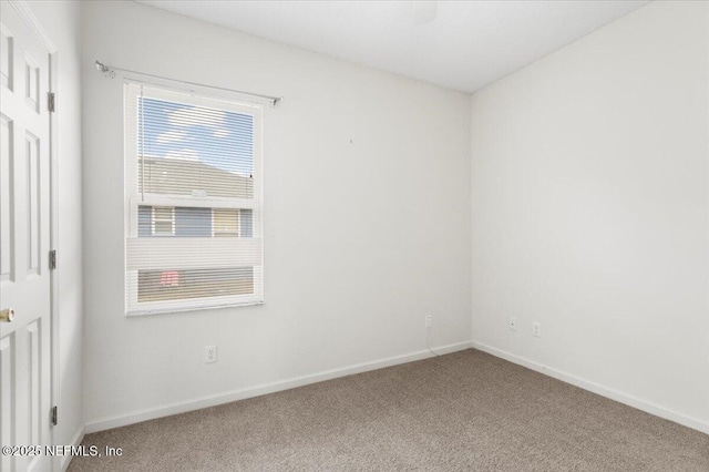 unfurnished room with carpet flooring