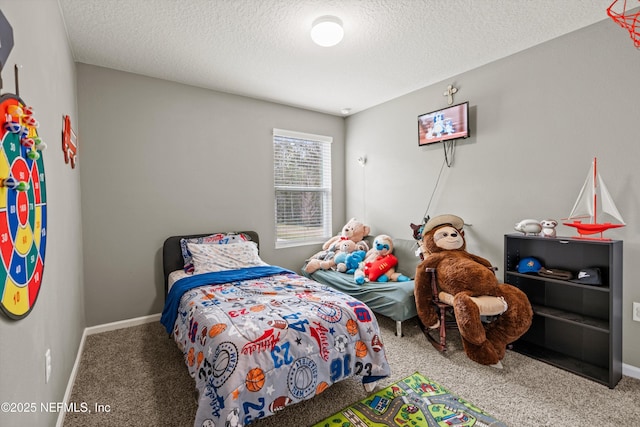 carpeted bedroom with a textured ceiling