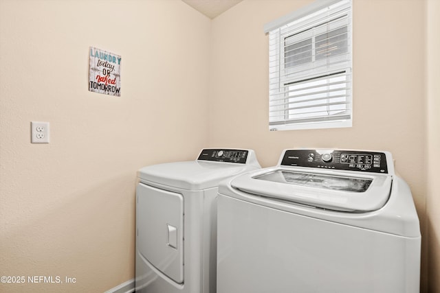 laundry area with independent washer and dryer