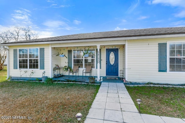 view of front of house with a front lawn and a porch