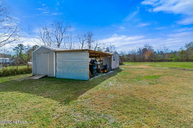 view of outdoor structure with a yard