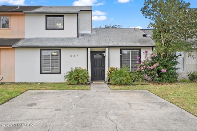 view of property featuring a front yard