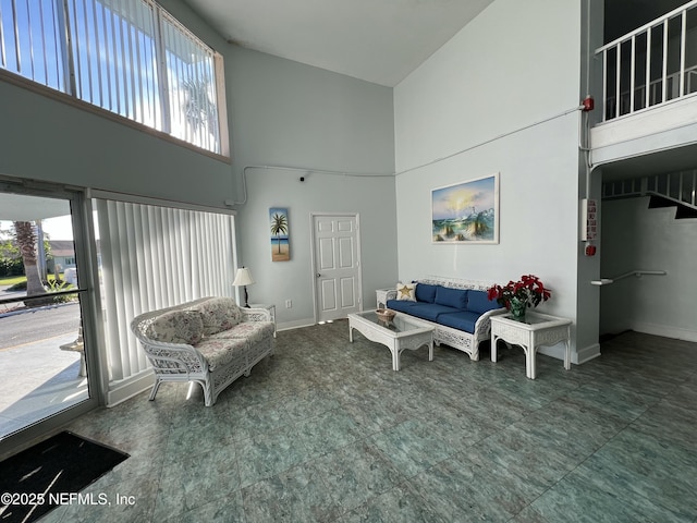 living room with a high ceiling