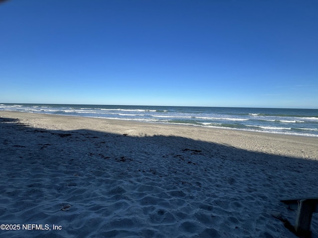 view of water feature with a beach view