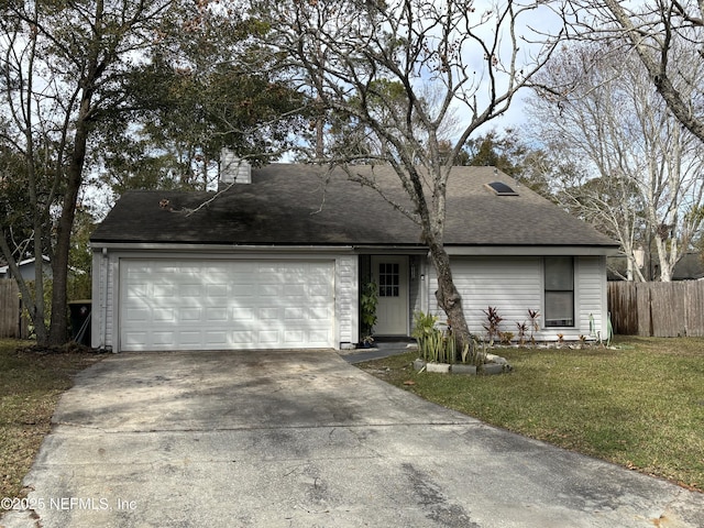 view of front facade with a front yard and a garage