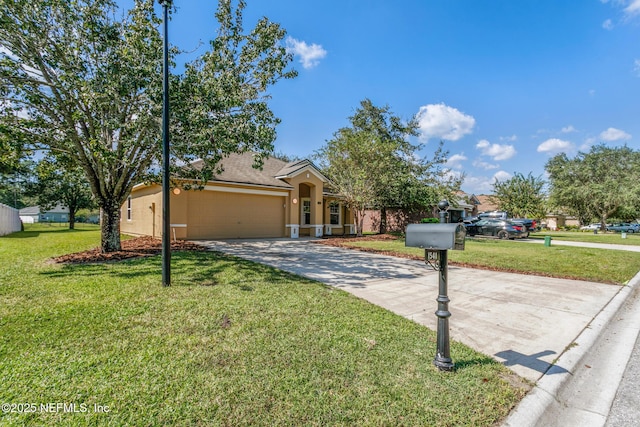 view of front of house with a garage, a front yard, concrete driveway, and stucco siding